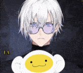 a man with white hair and glasses is holding a stuffed animal with a yellow face on it