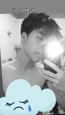 a man taking a picture of himself in a mirror with the words i love u below him