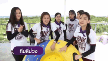 a group of girls wearing bnk eight shirts