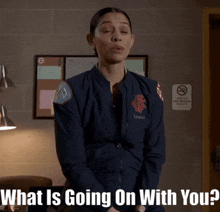a woman in a blue jacket with the words what is going on with you