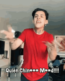 a man in a red shirt says quien chinxxx mxxd