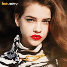 a close up of a woman 's face with a betsmove logo on the bottom