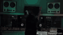 a recording studio with a makeagif.com link on the bottom right