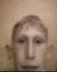 a close up of a man 's face with a blurred background and no eyes .