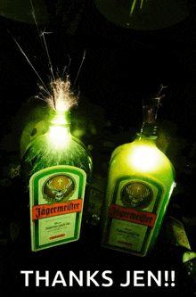 two bottles of jagermeifter with sparklers behind them