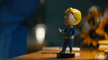 Tapping A Bobble Head Toy Vault Boy GIF - Tapping A Bobble Head Toy Vault Boy Fallout GIFs
