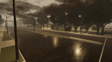 a black and white photo of a street with houses on it
