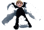 a person in a black suit is laying on the ground with their arms outstretched