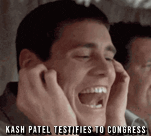 a man covering his ears with his hands with the caption kash patel testifies to congress