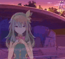 a girl with long hair is standing in front of a ferris wheel at sunset .