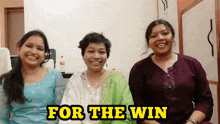 three women sitting next to each other with the words " for the win " in yellow letters