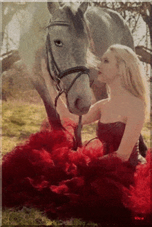 a woman in a red dress is petting a horse with vice written on the bottom