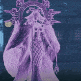 a purple statue of a woman is standing in front of a building .