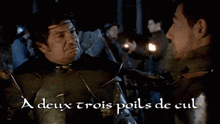 a man in armor talks to another man with the words " a deux trois poils de cul " written below him