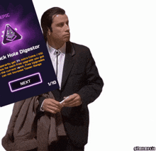 a man in a suit next to a screen that says epic