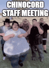 a group of men are dancing in a field with the caption chinocord staff meeting