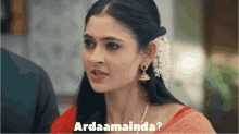 a woman with a flower in her hair and the words " ardaamainda " above her