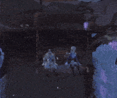 two dolls are sitting on a swing in a dark forest