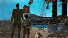 a man and a boy looking at a pirate ship in the water