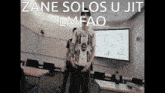 a man stands in front of a whiteboard with the words " zane solos u jit lmfao " above him