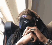 a person wearing a mask that says hip hop supreme on it