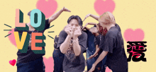 a group of people are making a heart shape with their hands and the word love is behind them