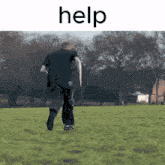 a person running in a field with the word help written above them