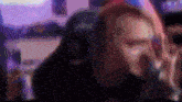 a blurry picture of a man sitting in a gaming chair .