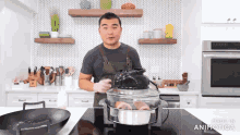 a man cooking in a kitchen with the words made in animatica on the bottom of the screen