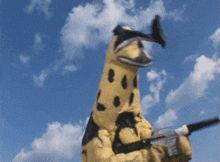 a yellow and black monster is holding a gun in front of a blue sky with clouds