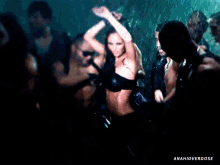 a group of people are dancing in the rain with the caption " anahioverdose " on the bottom