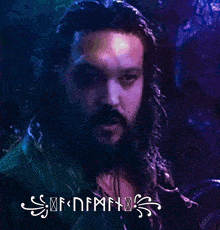 a close up of a man 's face with a purple background that says ' sdfnmr '
