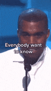 a man speaking into a microphone with the words " everybody want to know " written below him