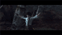 a woman is holding a gun and shooting at a monster in a video game