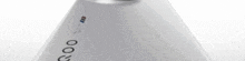 a close up of a camera lens on a white object