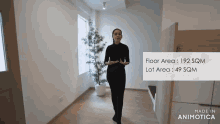 a woman is standing in a room with the floor area 192 sqm