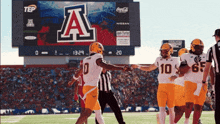 a group of football players with the letter a on their shirts