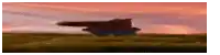 a blurred image of a plane flying over a field .