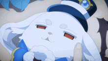 a white rabbit wearing a blue and white hat