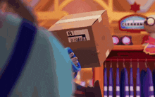a person holding a cardboard box that says b on it