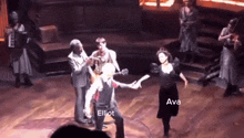 a group of people on a stage with elliot and ava written on the bottom