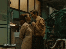 a man and a woman are standing next to each other with the hashtag lialmeida05 on the bottom right