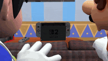 two cartoon characters looking at a nintendo switch on a couch