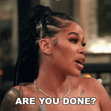 a woman with a tattoo on her arm is asking if she is done