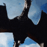 a dragon flying in the sky with its wings spread