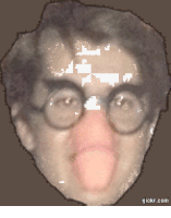a pixelated image of a man with glasses sticking his tongue out and the website gickr.com visible in the corner