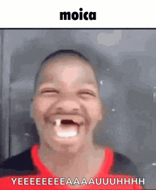 a young boy is making a funny face with his mouth open and a tooth missing .