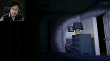 a man wearing headphones is standing in a dark room with a lamp and a dresser .