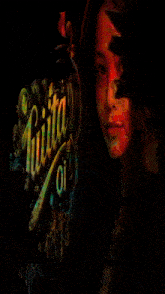 a woman 's face is behind a sign that says juiita