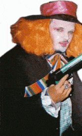 a man in a clown costume is holding a gun